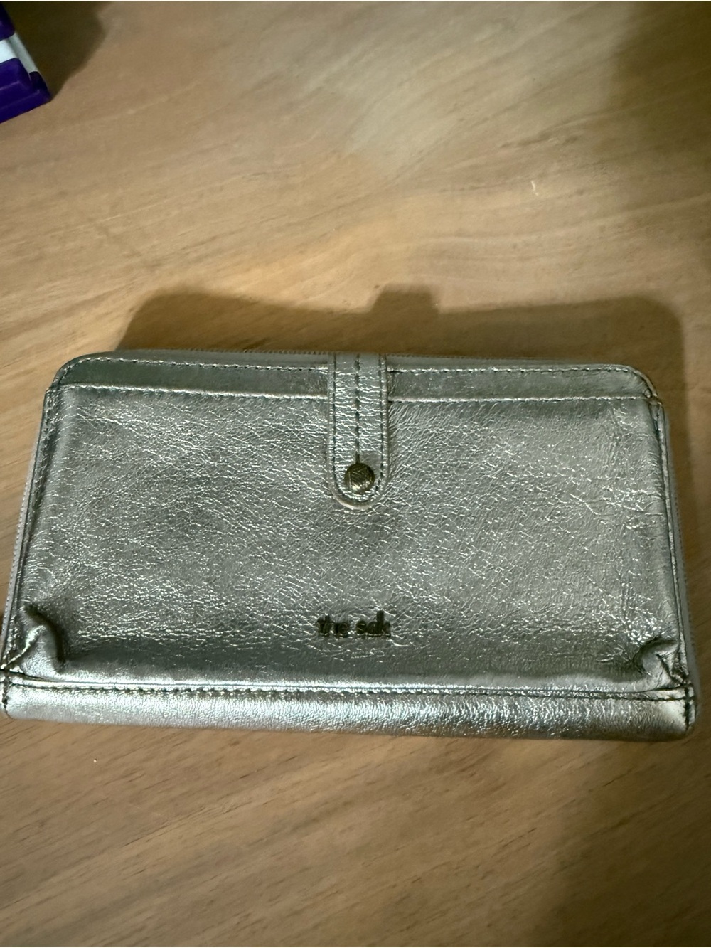 Metallic bronze ish.Not silver or gold but in between Women’s Wallet crossbody